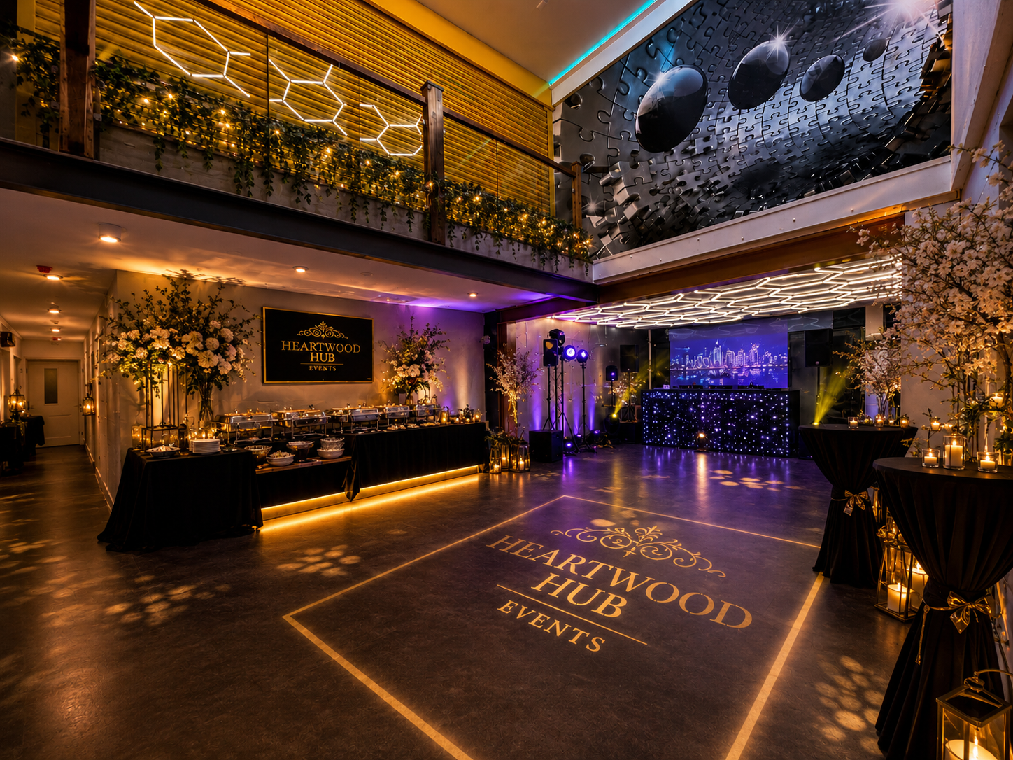 Heartwood Hub Events main hall styled with florals, candlelight and a gobo-lit dancefloor